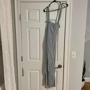 New with tags strappy jumpsuit! Light blue with pin white stripes.